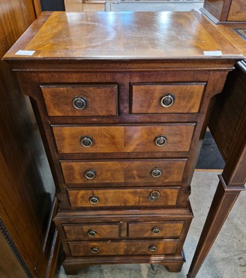 Lot 826 - A reproduction mahogany chest of drawers in...