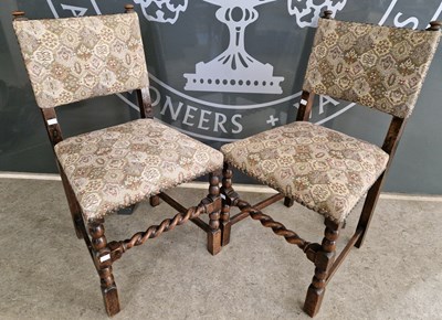 Lot 828 - A pair of early 20th century oak dining chairs...