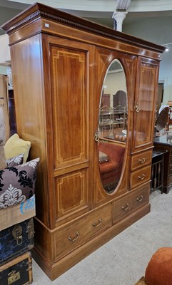 Lot 830 - An Edwardian mahogany inlaid wardrobe, the...