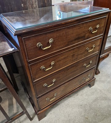 Lot 833 - A reproduction mahogany chest of four long...