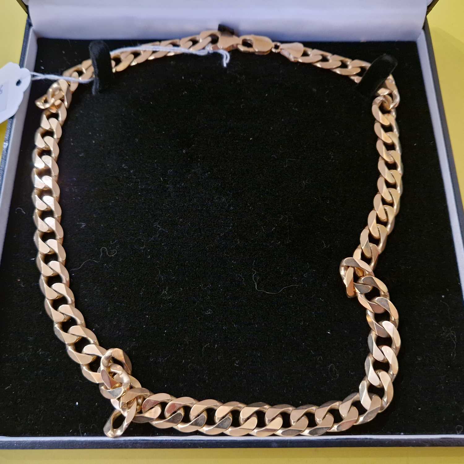 Lot 287 - A long 9ct gold curb link necklace, 102.2 grams.