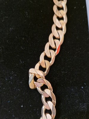 Lot 287 - A long 9ct gold curb link necklace, 102.2 grams.