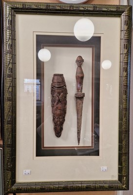 Lot 746 - A framed montage of Tribal dagger and scabbard,...