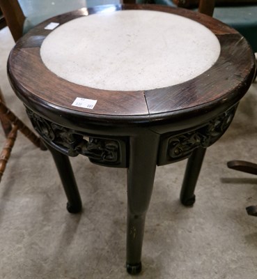 Lot 871 - A Chinese dark wood circular jardiniere stand...