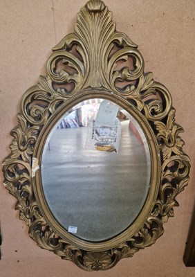 Lot 752 - A gilt framed oval bevelled wall mirror, 76cm...