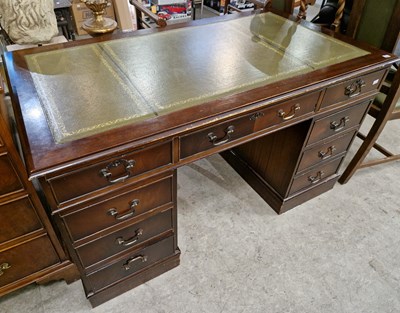 Lot 890 - A reproduction mahogany twin pedestal desk,...