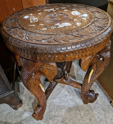 Lot 898 - An Indian carved jardiniere stand, the legs in...