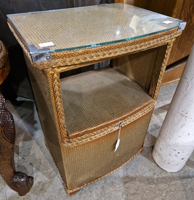 Lot 899 - A Lloyd Loom bedside locker, the open recess...