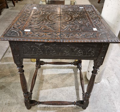 Lot 915 - An Antique carved oak occasional table.