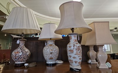 Lot 825 - Three assorted Asian style ceramic table lamps...