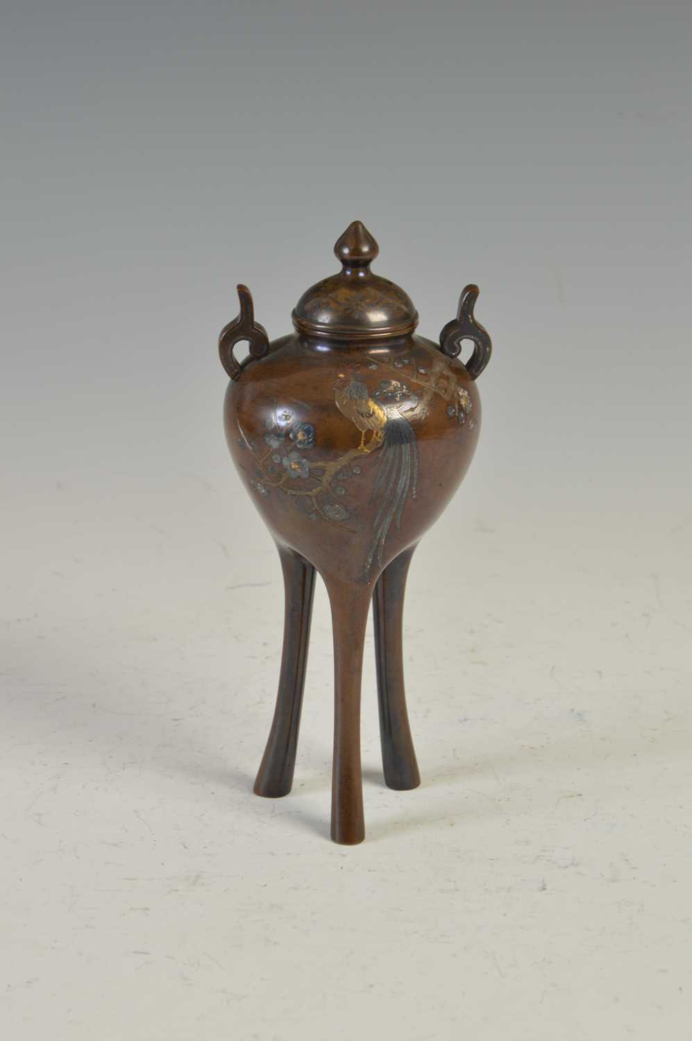 Lot 619 - A Japanese bronze twin handled koro and cover,...