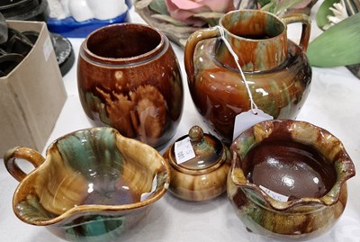 Lot 436 - A group of four Dunmore green & brown glazed...