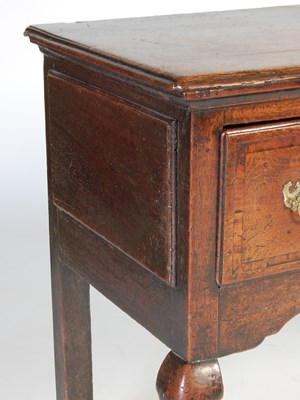 Lot 45 - A George III oak dresser, the rectangular top...