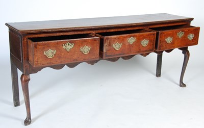 Lot 45 - A George III oak dresser, the rectangular top...