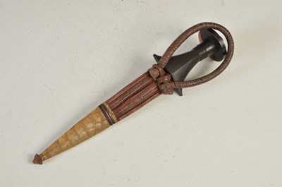 Lot 88 - An early 20th century African arm dagger, with...