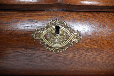 Lot 41 - A late 18th century Dutch oak bombe chest, the...