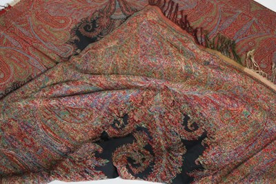 Lot 123 - A 19th century black ground paisley shawl,...