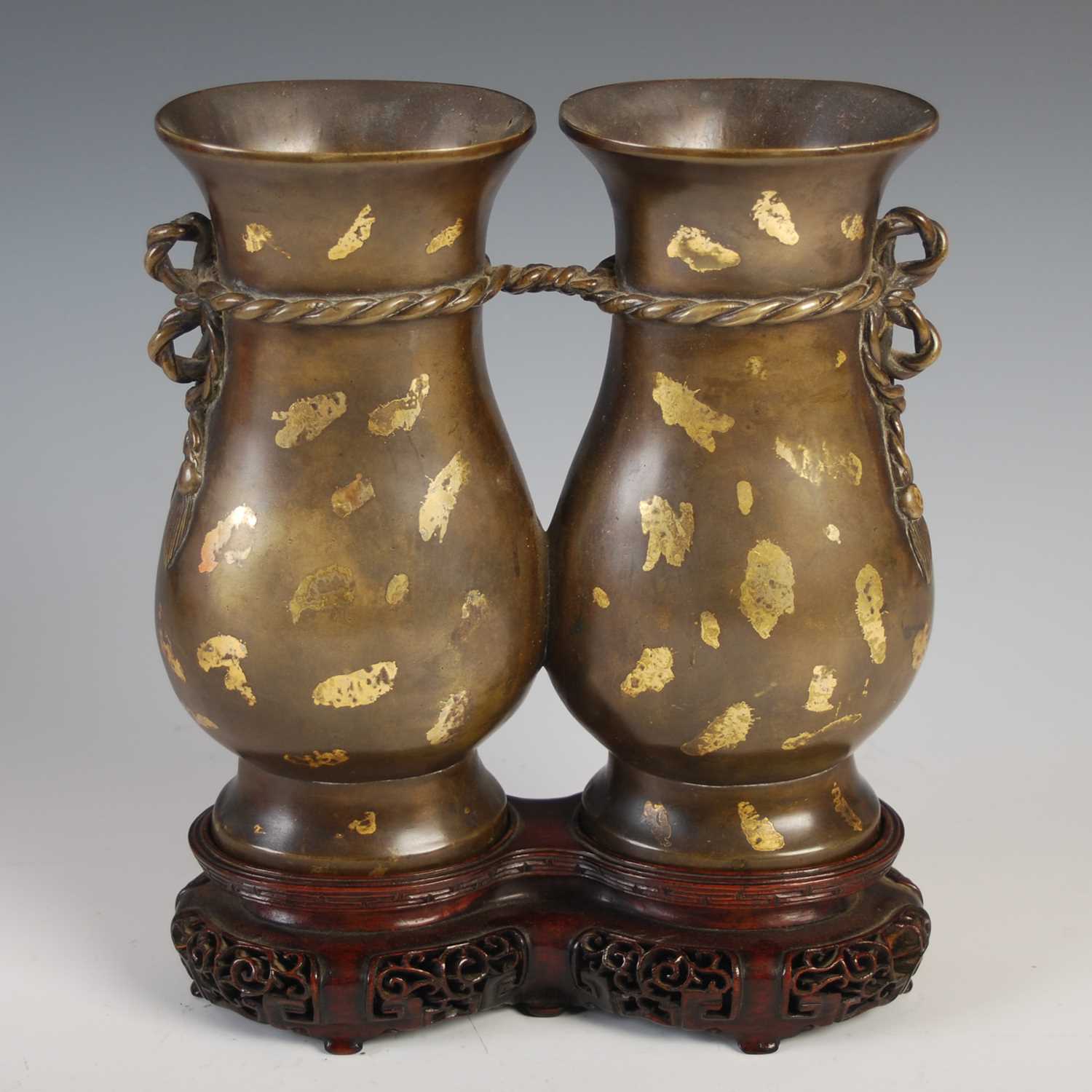 Lot 597 - A Chinese gold-splashed bronze double vase,...