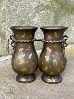 Lot 597 - A Chinese gold-splashed bronze double vase,...