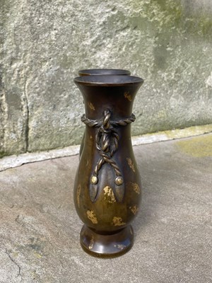 Lot 597 - A Chinese gold-splashed bronze double vase,...