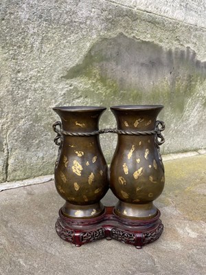 Lot 597 - A Chinese gold-splashed bronze double vase,...