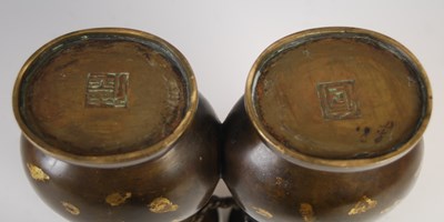 Lot 597 - A Chinese gold-splashed bronze double vase,...