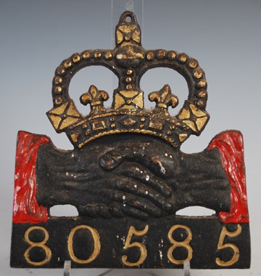 Lot 125 - A cast iron plaque for Hand in Hand Insurance...
