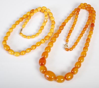 Lot 506 - A butterscotch amber necklace, formed from a...