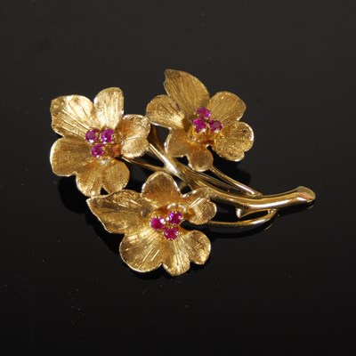 Lot 511 - An 18ct gold and synthetic ruby flower brooch,...