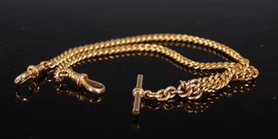 Lot 474 - A 9ct gold curb link Albert chain with T-bar...