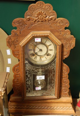 Lot 263 - A carved oak wall clock together with a...