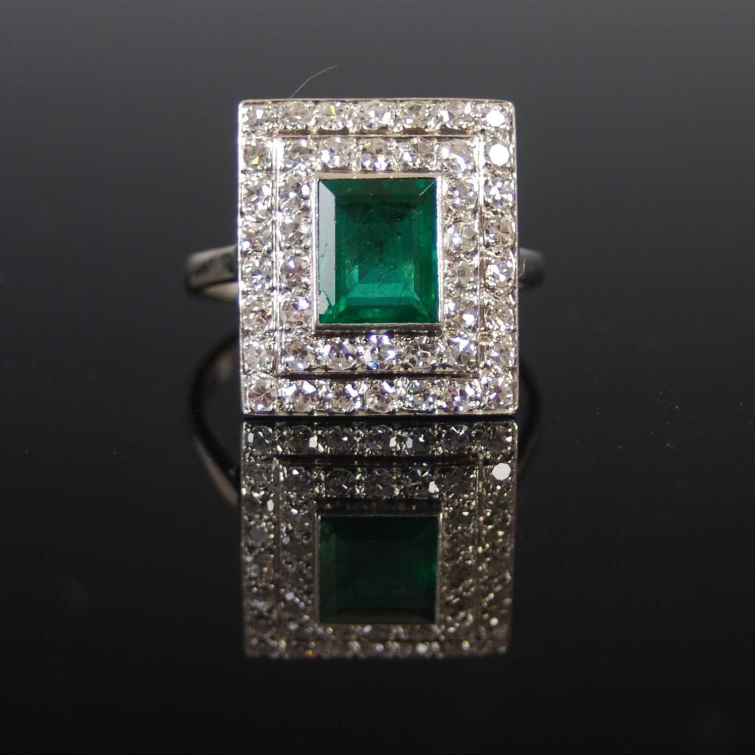 Lot 525 - A mid 20th century white metal, emerald and...