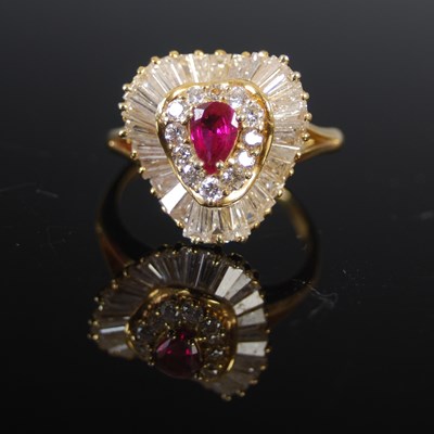 Lot 519 - A yellow metal ruby and diamond cluster ring,...