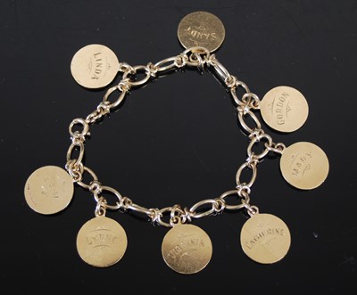 Lot 473 - A 9ct gold charm bracelet, suspending eight...