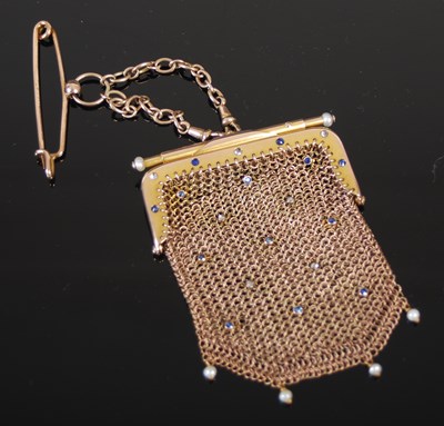 Lot 522 - A yellow metal pearl and sapphire studded...