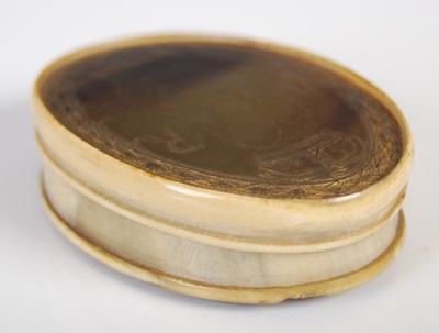 Lot 268 - A pressed horn oval snuff box, the pull-off...