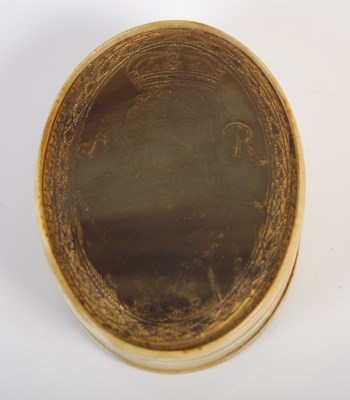 Lot 268 - A pressed horn oval snuff box, the pull-off...