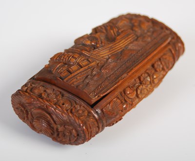 Lot 236 - A coquilla nut oblong snuff box richly carved...