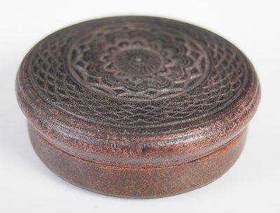 Lot 208 - A pressed leather circular snuff box, the...