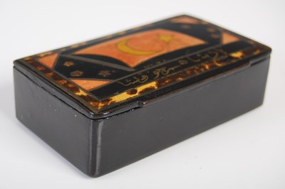 Lot 209 - A black lacquer papier-mâché oblong snuff box,...