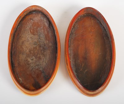 Lot 210 - A horn oval snuff box, the detachable cover...