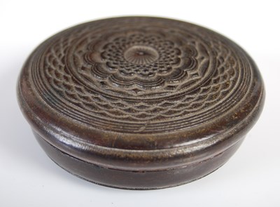 Lot 254 - A large pressed leather circular snuff box,...