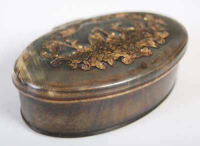 Lot 274 - A pressed horn oval snuff box, the hinged...