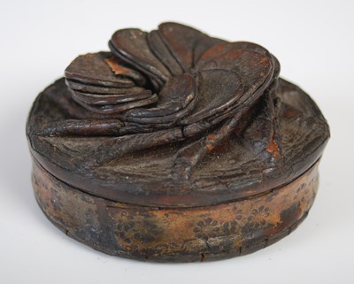 Lot 205 - A leather circular snuff box with folded...