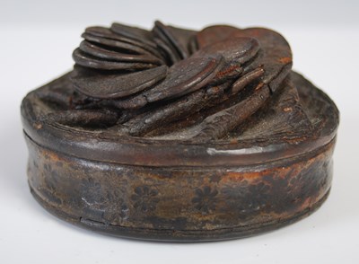 Lot 205 - A leather circular snuff box with folded...