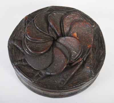 Lot 205 - A leather circular snuff box with folded...