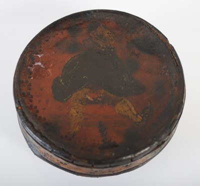 Lot 205 - A leather circular snuff box with folded...