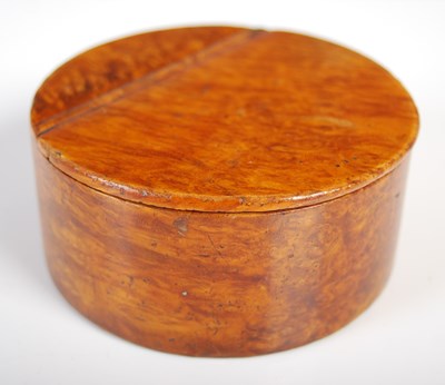 Lot 228 - A Mauchline ware circular snuff box in richly...