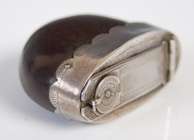 Lot 229 - A silver-mounted nutshell snuff box with...