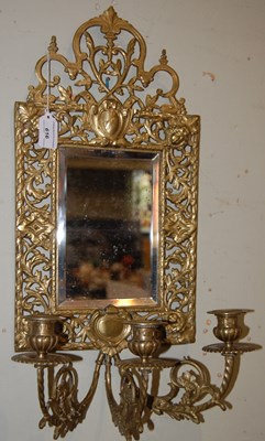 Lot 616 - A brass girandole wall mirror, set with...